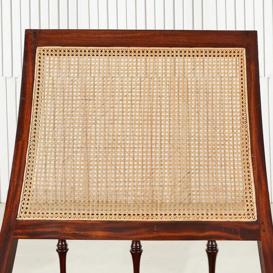 Rattan wicker detail on the backrest of the colonial lazy chair